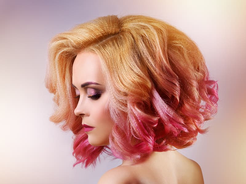 A model with professionally colored and styled hair